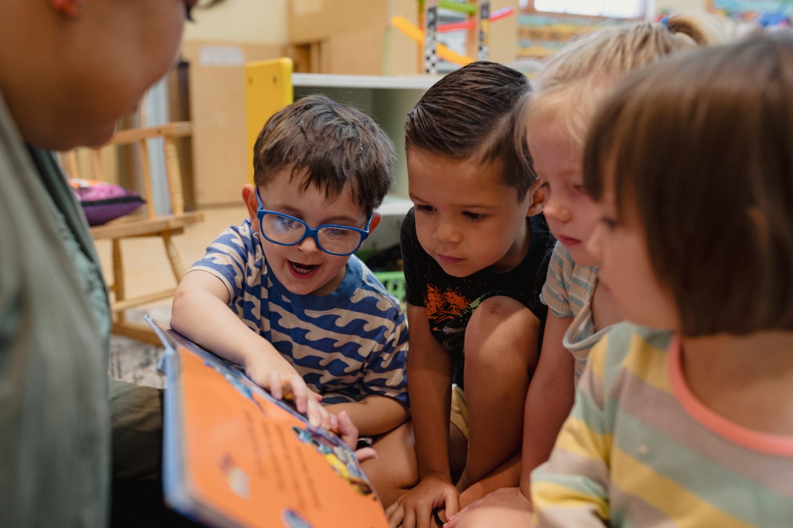 Niko Bailey, Kayden Monsey, Brooke Black, and Aurelia De Maeseneer engage in a story time reading.