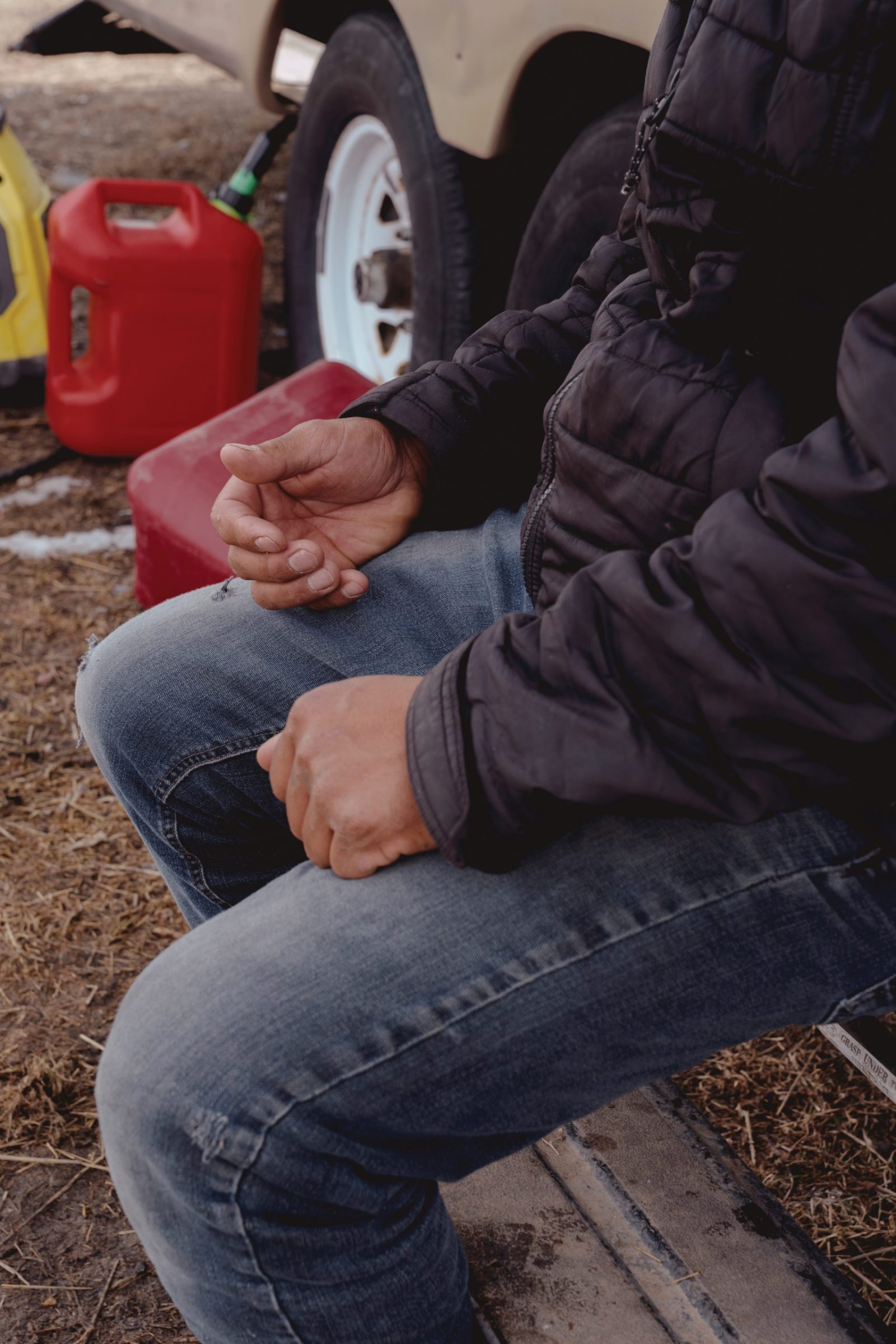 A resident sitting outside of their camper in Bozeman.