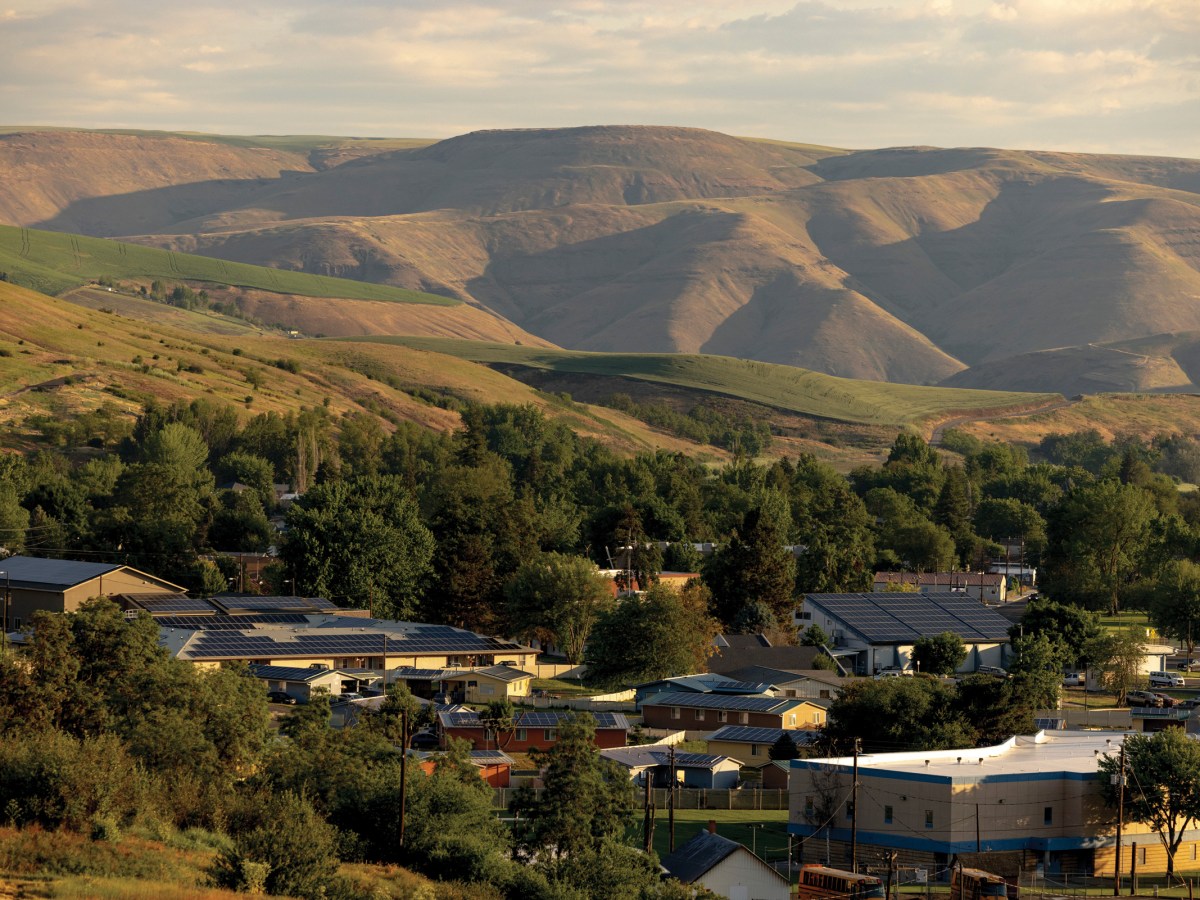 Solar panels sit on top of buildings and homes in Lapwai, Idaho.
