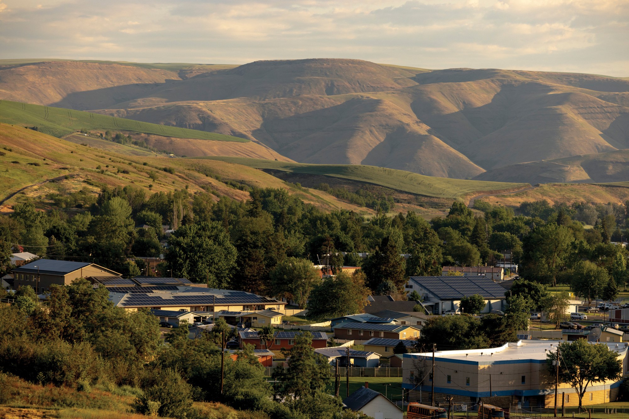 Solar panels sit on top of buildings and homes in Lapwai, Idaho.
